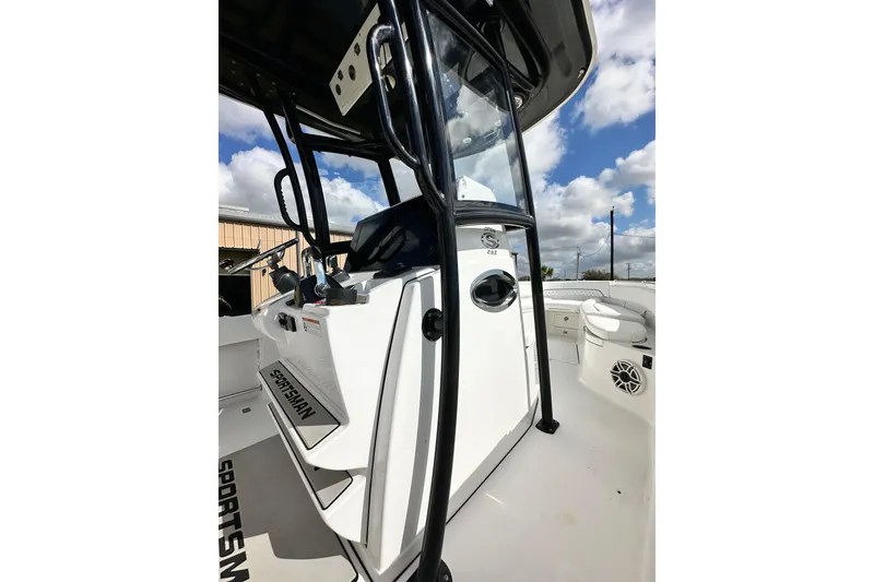 Slide: The Image of 2021 Sportsman Open 282 Center Console boat interior with steering console and seating. - 34