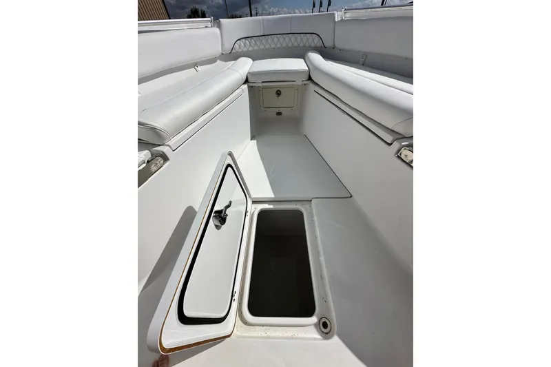 Slide: The Image of 2021 Sportsman Open 282 Center Console boat interior with open storage compartment. - 41