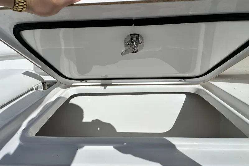 Slide: The Image of Open storage compartment on 2021 Sportsman Open 282 Center Console boat. - 43