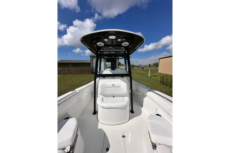 Slide: The Image of 2021 Sportsman Open 282 Center Console boat under clear blue sky. - 45