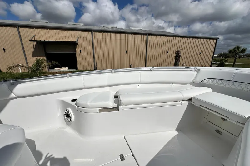 Slide: The Image of 2021 Sportsman Open 282 Center Console boat interior with white seating and storage compartments. - 46
