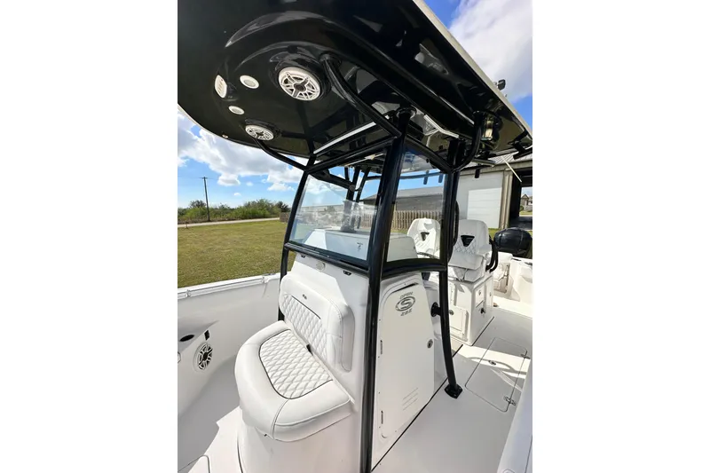 Slide: The Image of 2021 Sportsman Open 282 Center Console boat interior with seating and console view. - 49