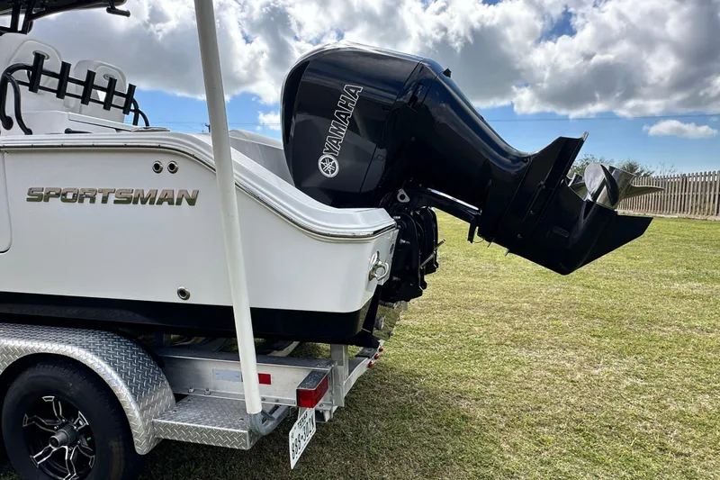 Slide: The Image of 2021 Sportsman Open 282 Center Console boat with Yamaha outboard motor on trailer. - 6