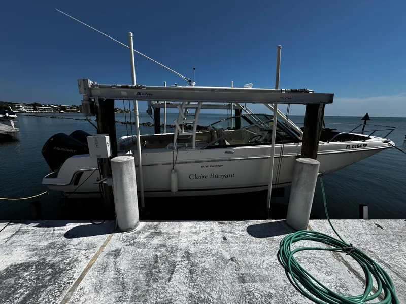 Slide: The Image of 2019 Boston Whaler 270 Vantage docked by the waterfront. - 11
