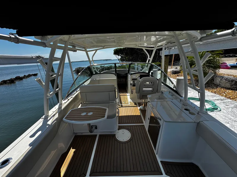 Slide: The Image of 2019 Boston Whaler 270 Vantage boat interior with seating and ocean view. - 13