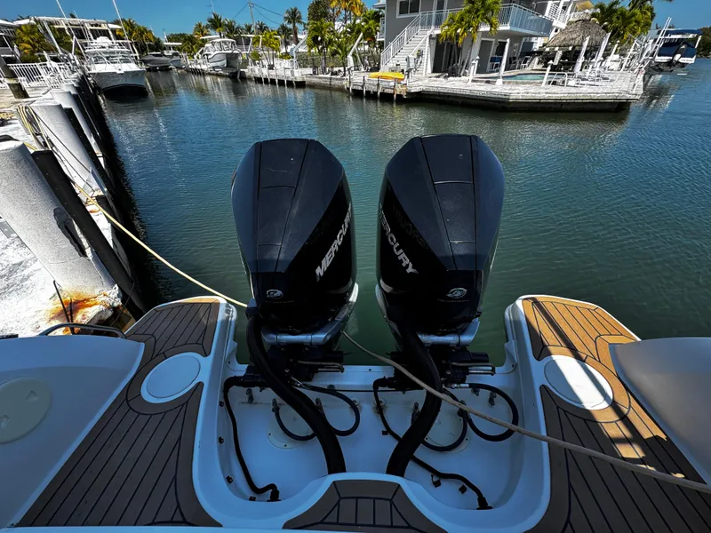 Slide: The Image of 2019 Boston Whaler 270 Vantage with twin Mercury outboard engines docked at marina. - 16