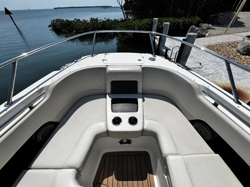 Slide: The Image of 2019 Boston Whaler 270 Vantage boat interior with seating, near water. - 29
