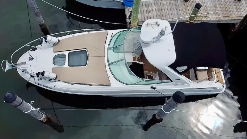 Slide: The Image of Overhead view of a 2012 Sea Ray 310 Sundancer docked at a marina. - 2