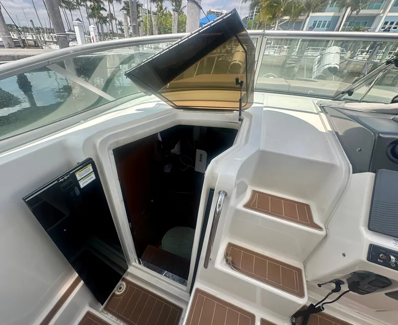 Slide: The Image of 2012 Sea Ray 310 Sundancer cabin entrance with open hatch and steps. - 26