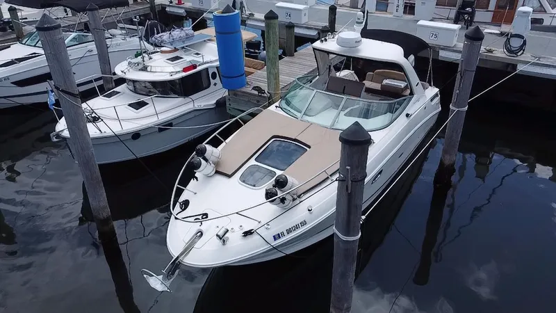 Slide: The Image of 2012 Sea Ray 310 Sundancer docked at marina, aerial view. - 4