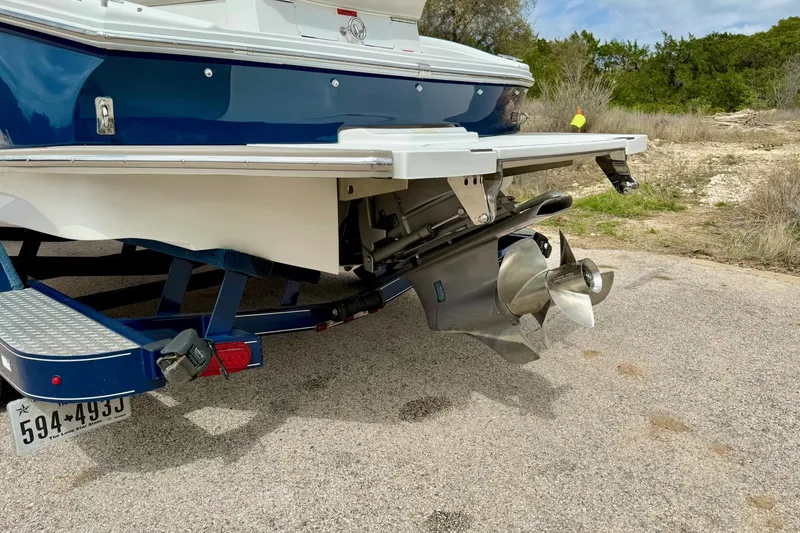 Slide: The Image of 2016 Cobalt CS3 boat on trailer, showing propeller and rear details. - 13