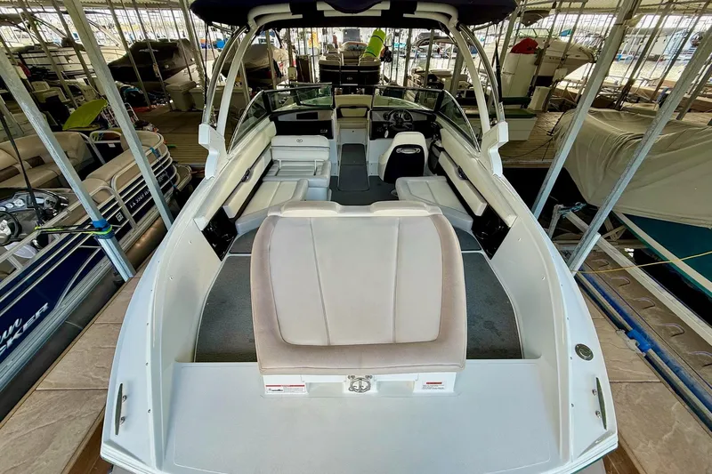 Slide: The Image of 2016 Cobalt CS3 boat interior in marina, featuring spacious seating and modern design. - 18