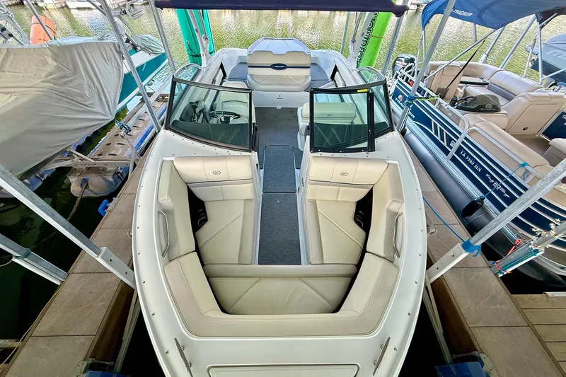 Slide: The Image of 2016 Cobalt CS3 boat with spacious seating docked at marina. - 20