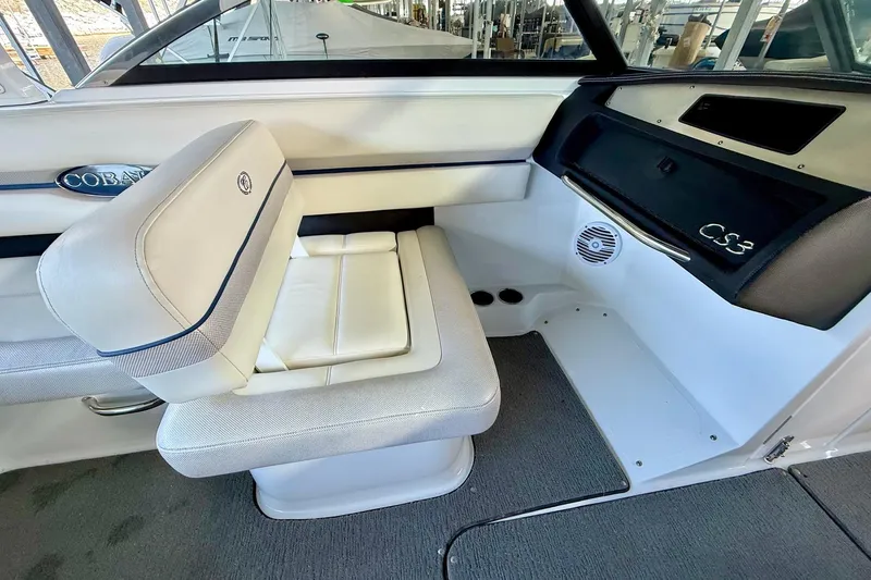 Slide: The Image of Interior of 2016 Cobalt CS3 boat with white seating and dashboard. - 25