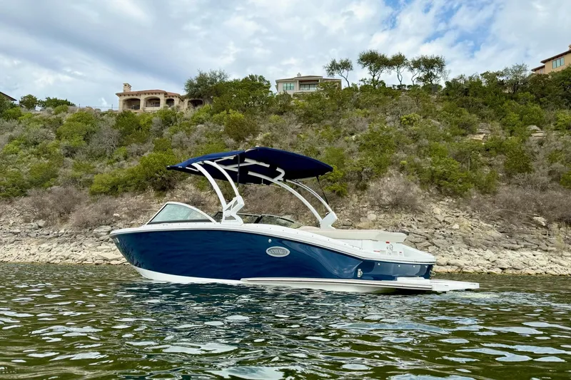 Slide: The Image of 2016 Cobalt CS3 boat on a lake with hillside background. - 3