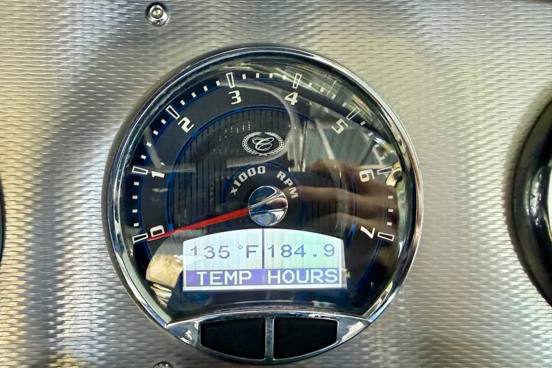 Slide: The Image of Tachometer of 2016 Cobalt CS3 showing 135°F and 184.9 hours. - 30