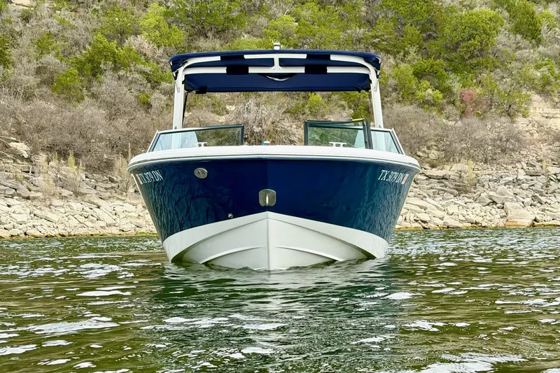 Slide: The Image of 2016 Cobalt CS3 boat on water, rocky shoreline background. - 8
