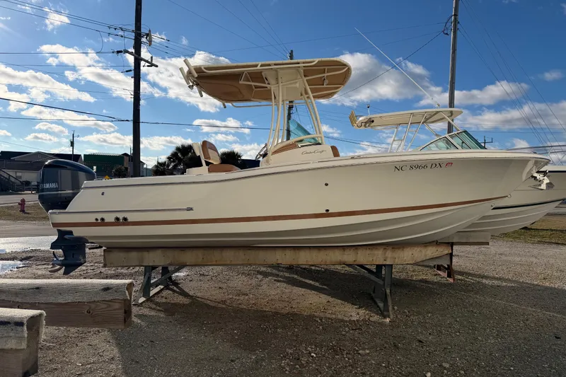 Slide: The Image of 2013 Chris-Craft Catalina 23 boat on display, featuring Yamaha outboard motor. - 12