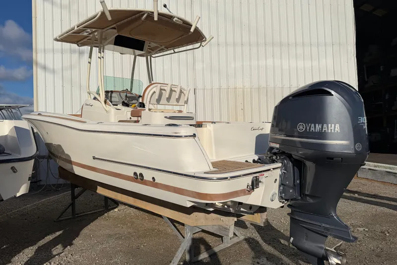 Slide: The Image of 2013 Chris-Craft Catalina 23 boat with Yamaha engine, parked outdoors. - 16