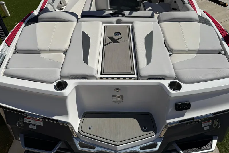 Slide: The Image of 2021 MasterCraft XStar boat with sleek seating and modern design features. - 10