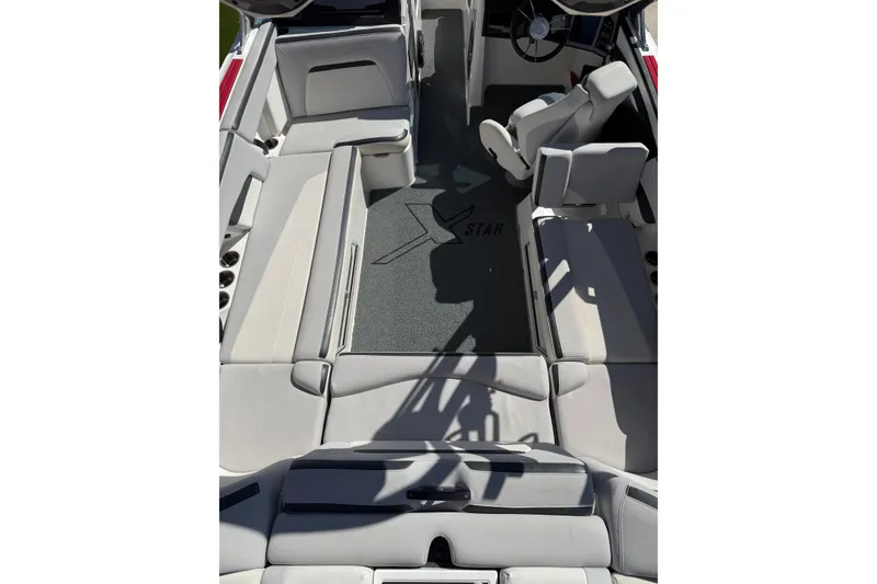 Slide: The Image of 2021 MasterCraft XStar boat interior with spacious seating and modern design. - 12