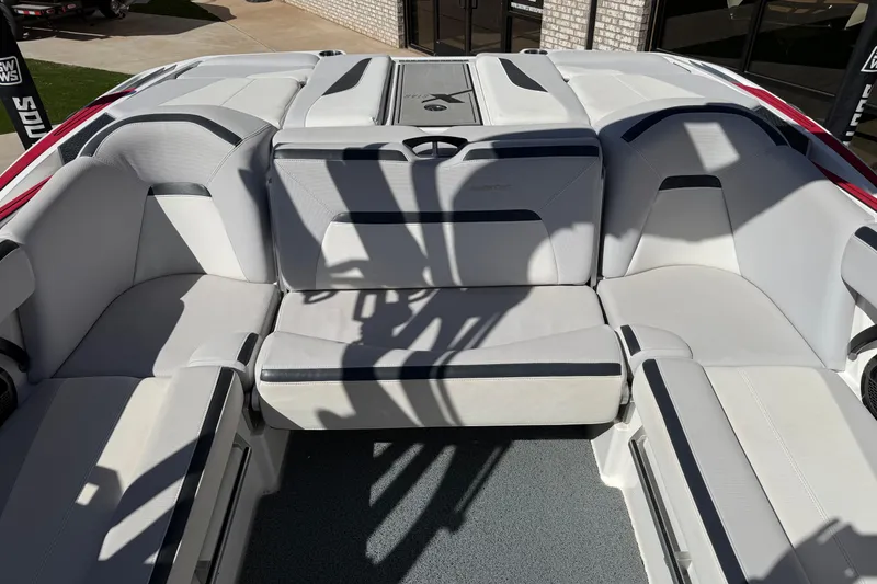 Slide: The Image of 2021 MasterCraft XStar boat interior with luxurious white seating and modern design. - 16