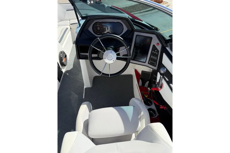 Slide: The Image of 2021 MasterCraft XStar boat cockpit with modern steering and controls. - 18