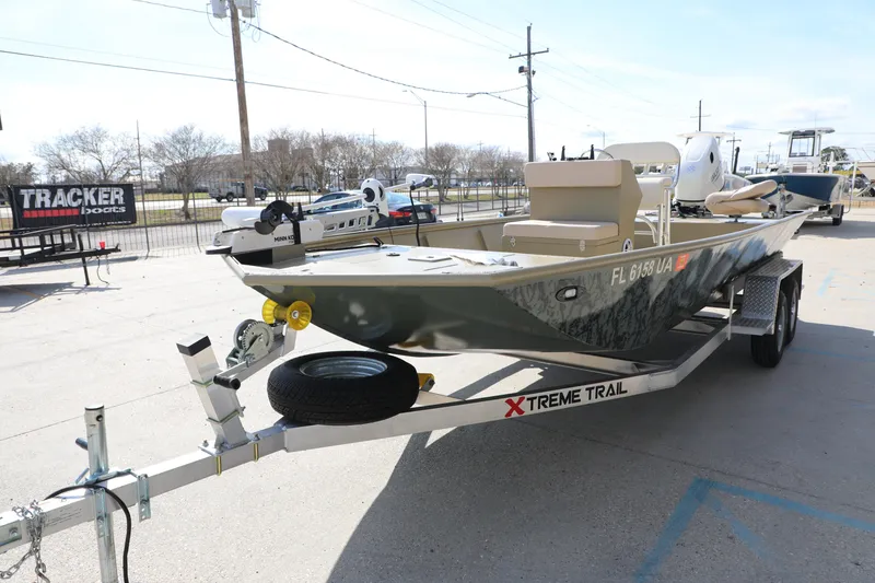 Slide: The Image of 2025 Extreme Boats 2072 CC on trailer, displayed outdoors at a dealership. - 8