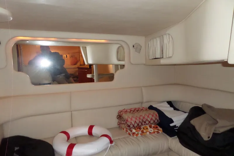 Slide: The Image of Interior cabin of 2001 Sea Ray 340 Sundancer with seating and life preserver. - 14