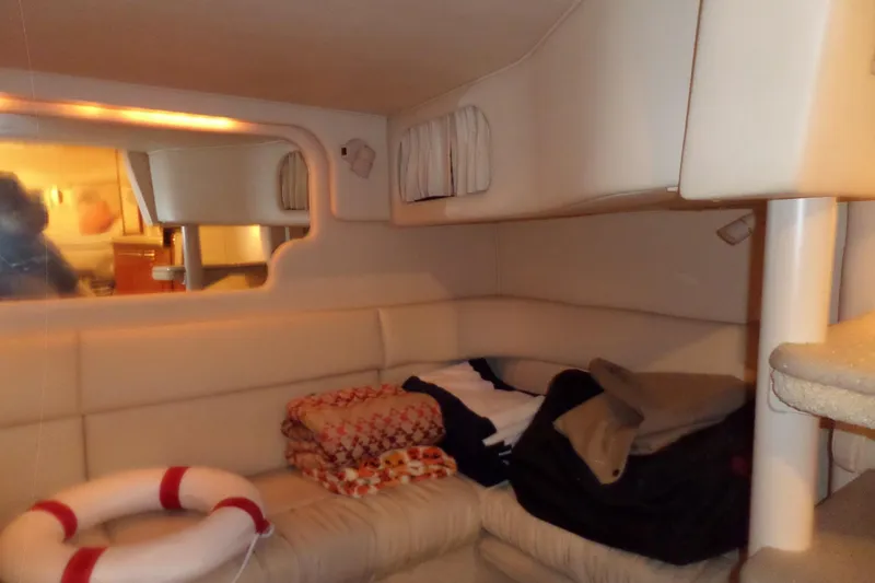 Slide: The Image of Interior of 2001 Sea Ray 340 Sundancer with cozy seating and life preserver. - 15