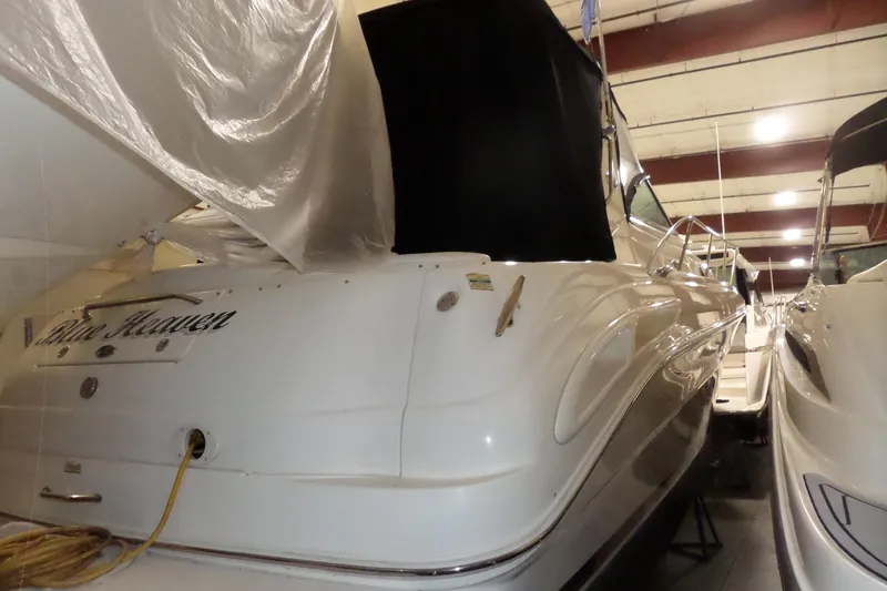 Slide: The Image of 2001 Sea Ray 340 Sundancer yacht in indoor storage, rear view. - 2