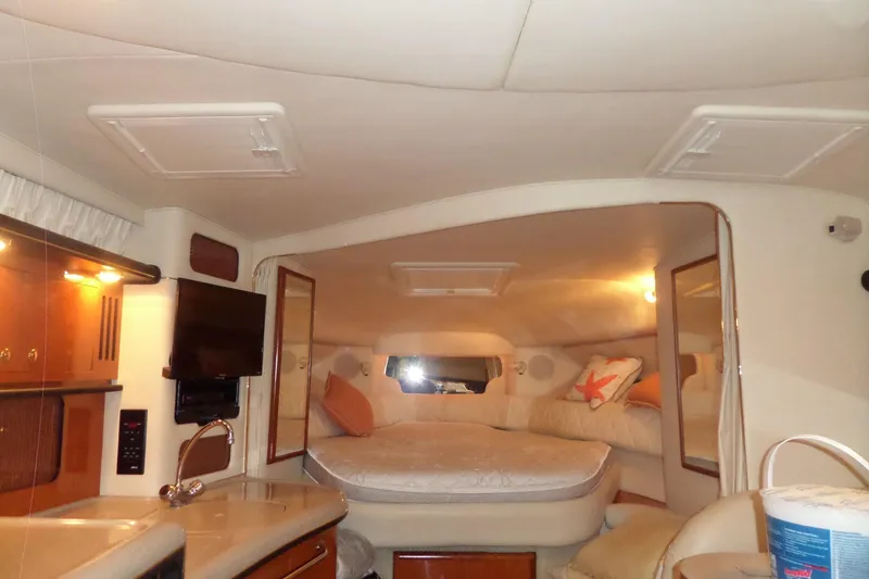 Slide: The Image of Interior of 2001 Sea Ray 340 Sundancer yacht with cozy cabin and modern amenities. - 20