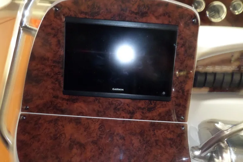 Slide: The Image of Garmin display on 2001 Sea Ray 340 Sundancer boat dashboard with wood finish. - 24