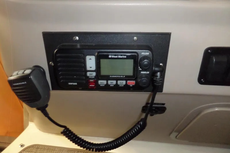 Slide: The Image of VHF radio system on 2001 Sea Ray 340 Sundancer boat dashboard. - 26