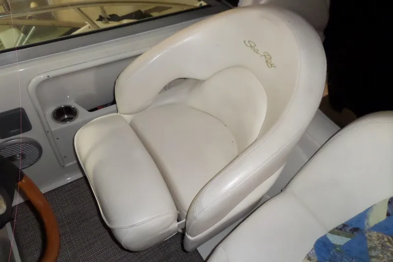 Slide: The Image of White leather seat in 2001 Sea Ray 340 Sundancer boat cockpit. - 27