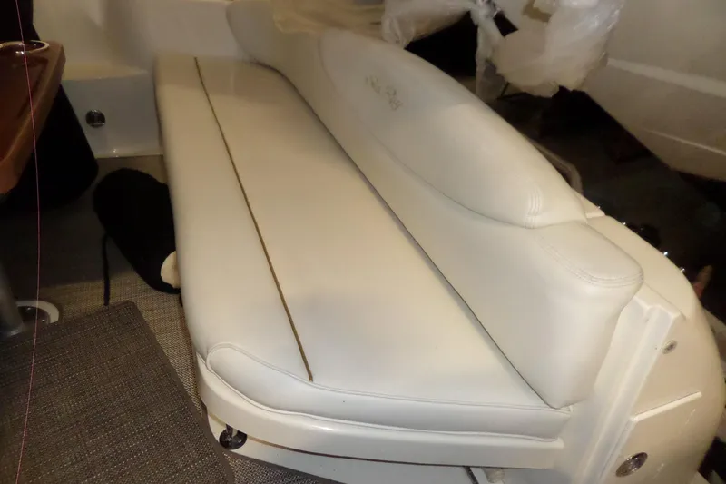 Slide: The Image of White leather seating on a 2001 Sea Ray 340 Sundancer boat interior. - 34