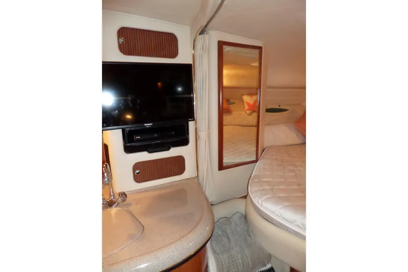 Slide: The Image of Interior of 2001 Sea Ray 340 Sundancer with TV, mirror, and bed. - 6