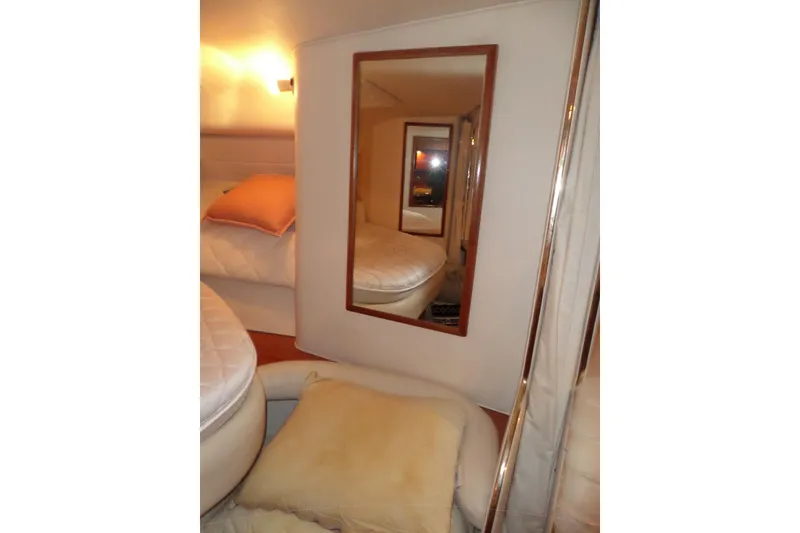 Slide: The Image of Interior cabin of 2001 Sea Ray 340 Sundancer with mirror and cozy bedding. - 7