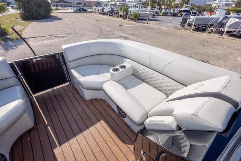 Slide: The Image of Luxurious seating on 2024 Manitou 25 LX SRW Dual Engine boat, featuring elegant upholstery. - 33