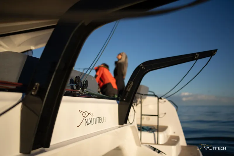 Slide: The Image of 2025 Nautitech 48 Open yacht on calm sea, featuring sleek design and modern amenities. - 26