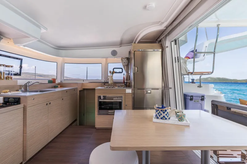 Slide: The Image of Modern kitchen interior of 2025 Lagoon 38 catamaran with ocean view. - 32