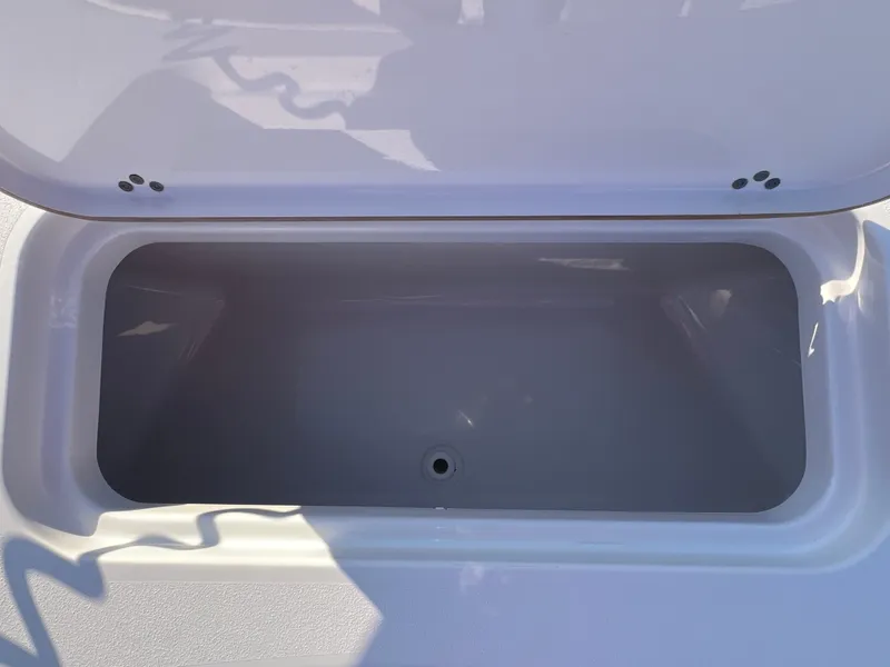 Slide: The Image of 2020 Sportsman Masters 267OE Bay Boat seating area with storage compartment. - 47