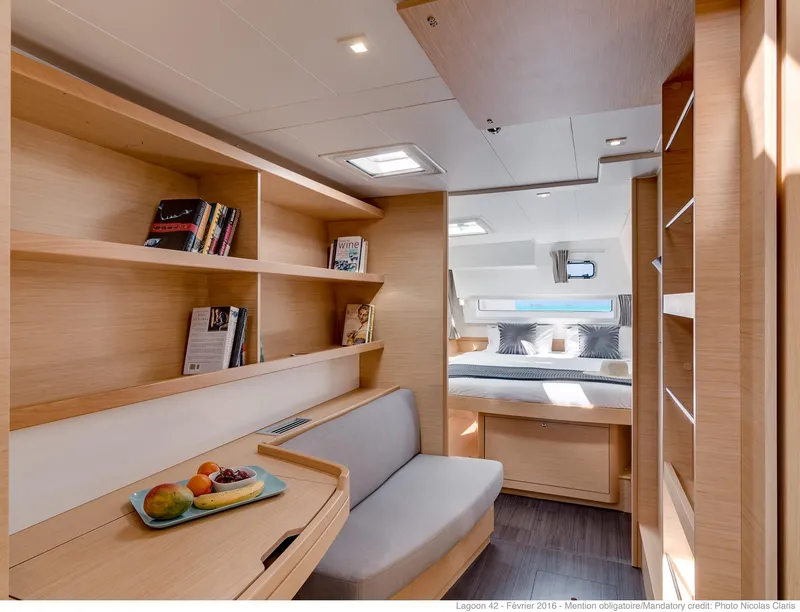 Slide: The Image of Interior of 2025 Lagoon 42 Millenium yacht with modern design and cozy seating area. - 11