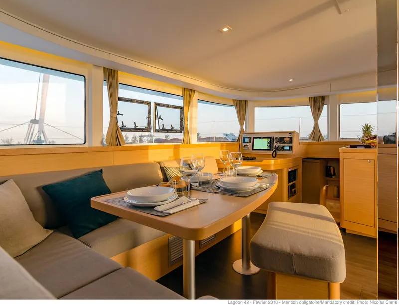 Slide: The Image of Luxurious interior of 2025 Lagoon 42 Millenium catamaran with elegant dining setup. - 7