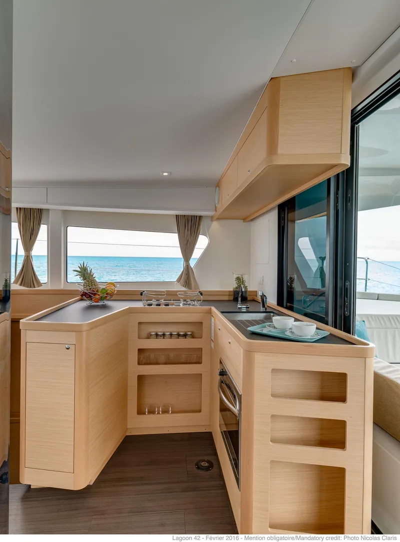 Slide: The Image of Modern kitchen interior of 2025 Lagoon 42 Millenium yacht with ocean view. - 9