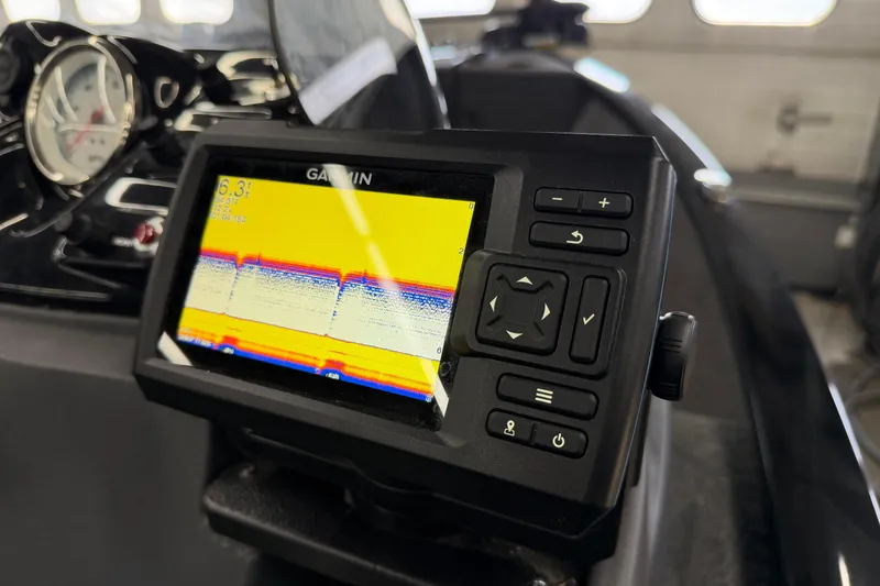 Slide: The Image of Garmin fishfinder display on 2025 Tracker Super Guide V-16 SC boat dashboard. - 11