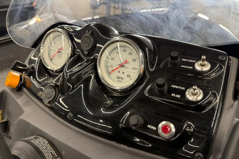Slide: The Image of Dashboard of 2025 Tracker Super Guide V-16 SC boat with gauges and controls. - 12