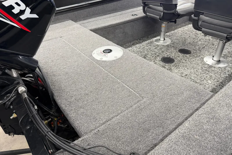 Slide: The Image of 2025 Tracker Super Guide V-16 SC boat interior with seating and motor details. - 8