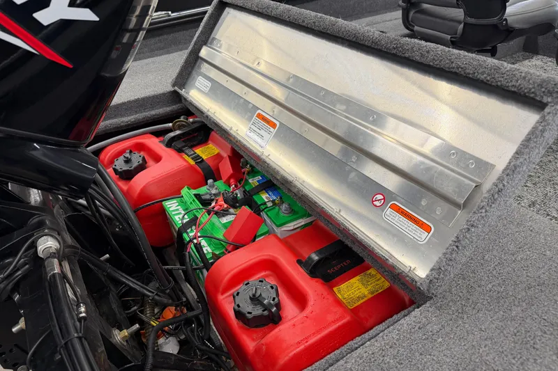 Slide: The Image of 2025 Tracker Super Guide V-16 SC boat battery and fuel storage compartment. - 9