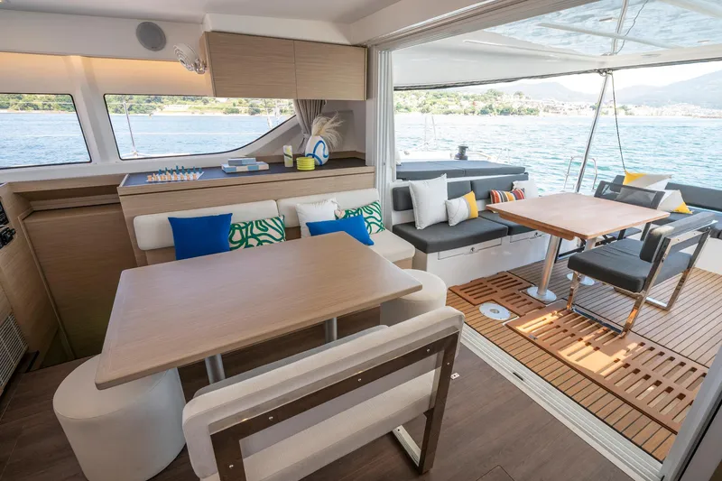 Slide: The Image of Luxurious interior of 2025 Lagoon 43 yacht with modern seating and scenic water view. - 26